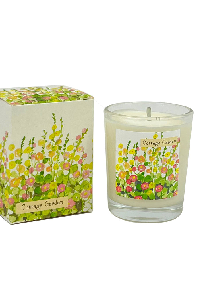 Candle with floral design packaging on a white background