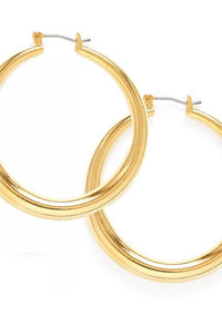 Gold hoop earrings on a white background
