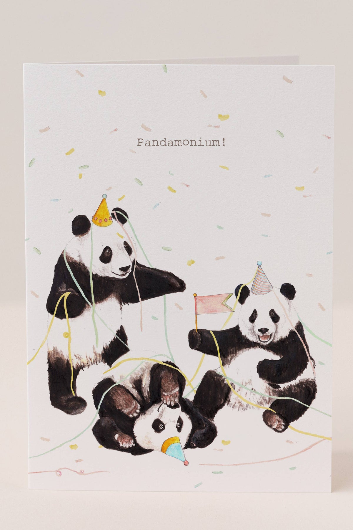 Greeting card with illustrations of pandas celebrating, featuring the word 'Pandamonium'.