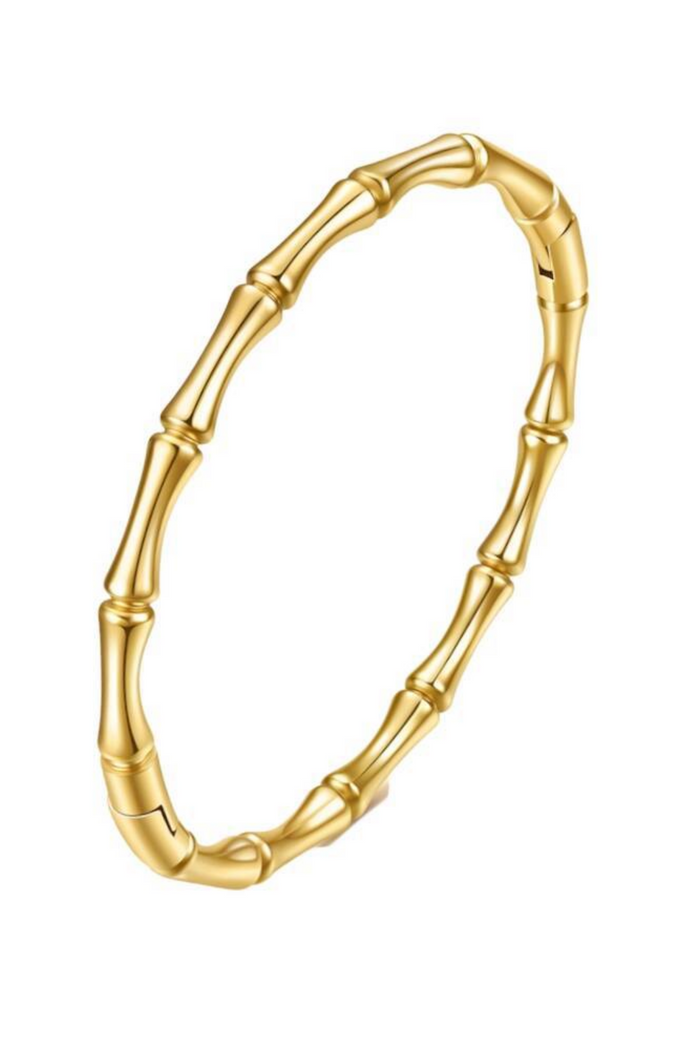 A gold-plated bangle bracelet designed to look like a bamboo stalk, featuring segmented nodes and a polished finish, shown on a plain white background.