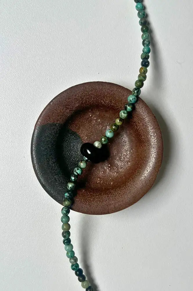 Palm Of Feronia Turquoise Oynx Gemstone Movement Necklace