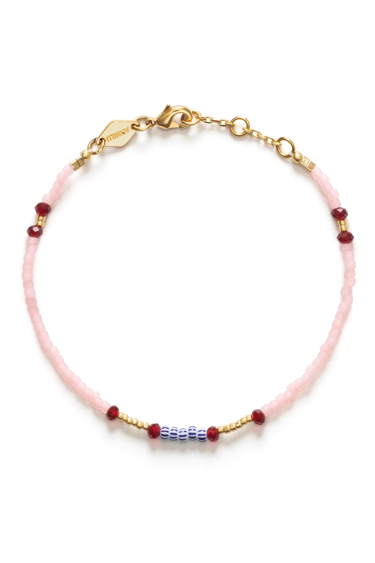 Pink beaded bracelet with gold accents on a white background
