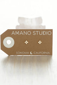 Earring card with earrings on a white background, featuring 'AMANO STUDIO' branding.