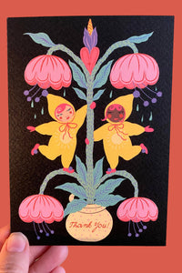 Greeting card with colorful design of flowers and characters on a black background