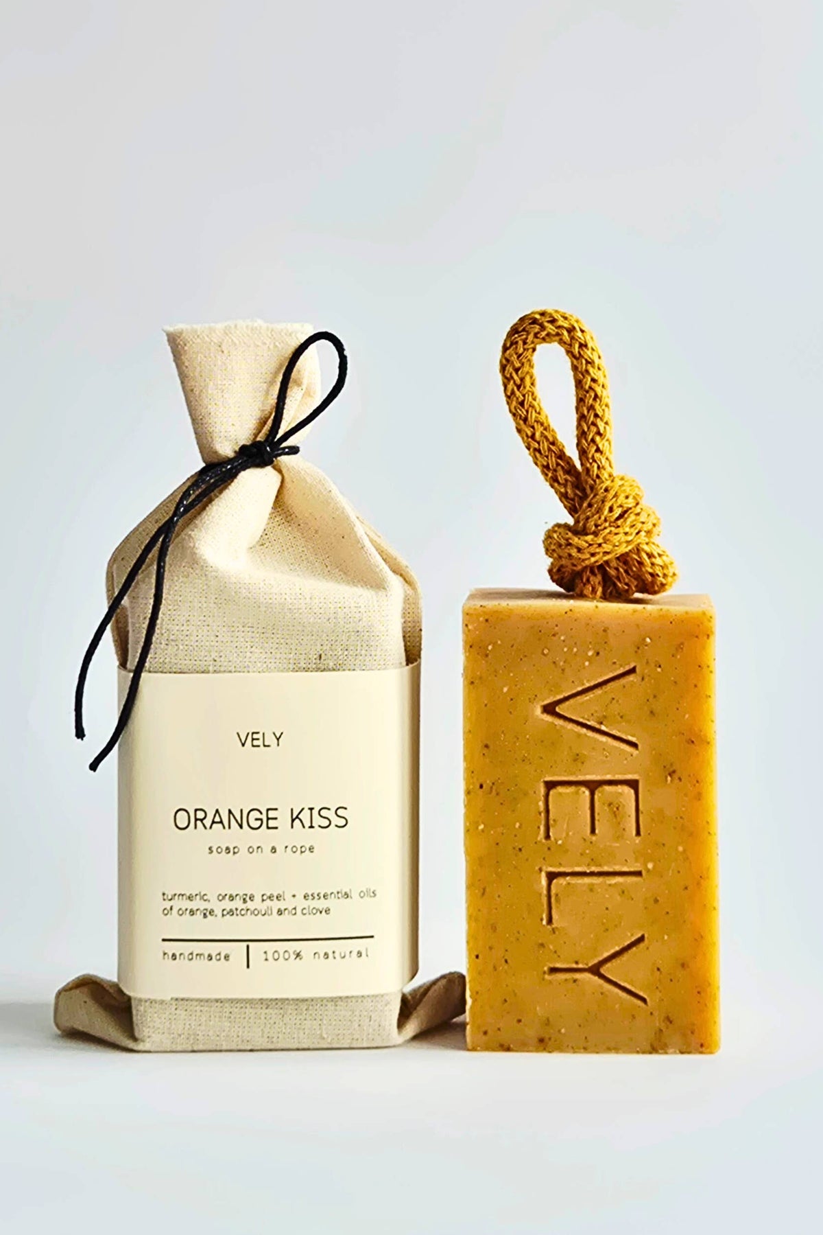 Vely soap and packaging on a light gray background