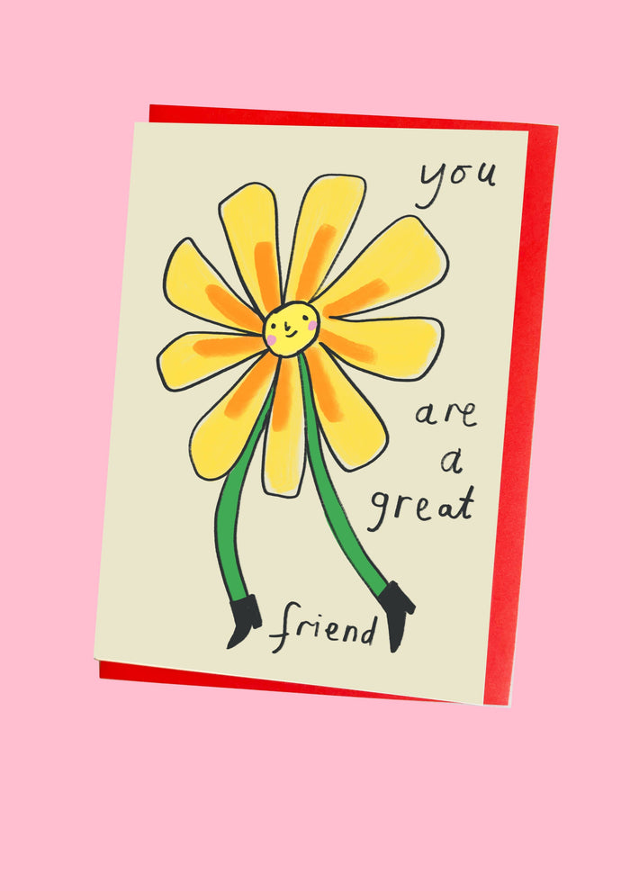 Card with a yellow flower illustration and text on a pink background