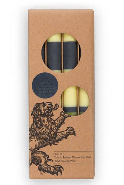 Pack of four candles in a cardboard box with a lion illustration on a white background