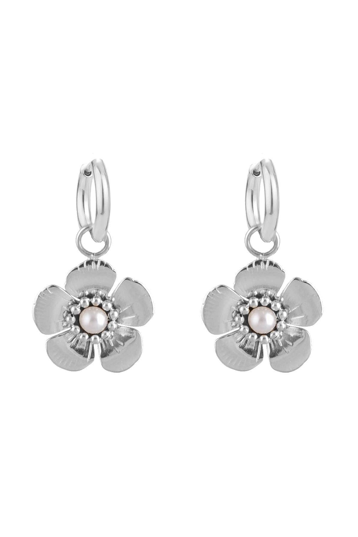Pair of silver flower-shaped earrings on a white background