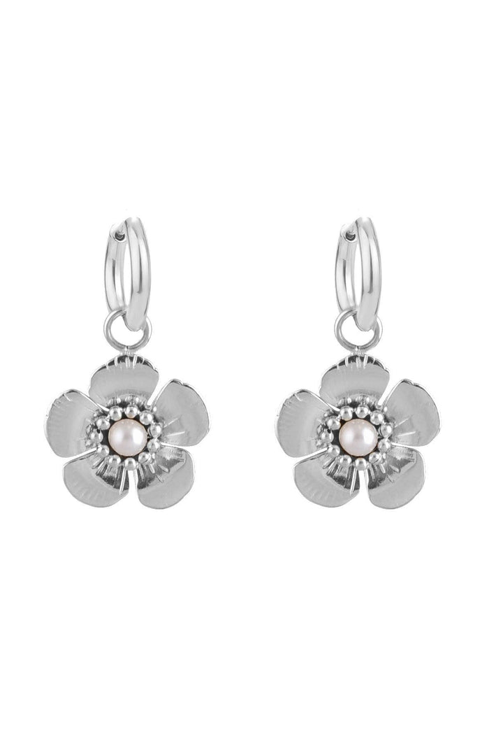 Pair of silver flower-shaped earrings on a white background