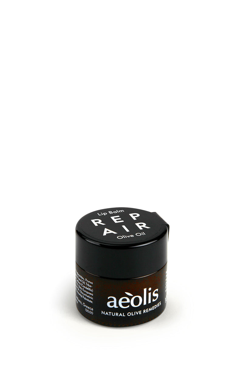 A small black jar of aéolis Repair Air Natural Olive Remover hair product, photographed on a seamless white background.