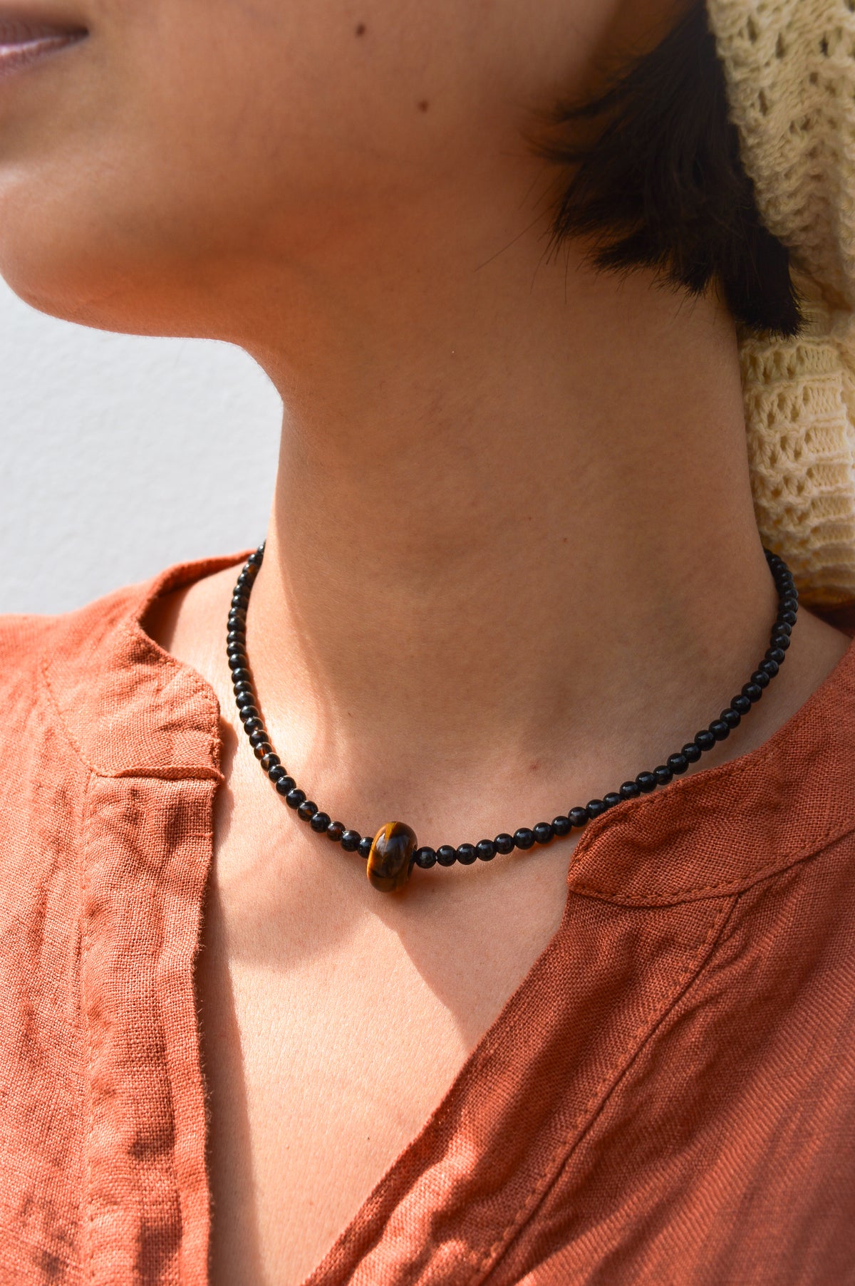 Palm Of Feronia Noir Gemstone Movement Necklace