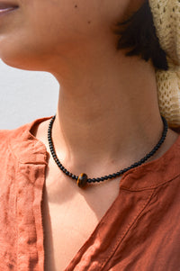 Palm Of Feronia Noir Gemstone Movement Necklace