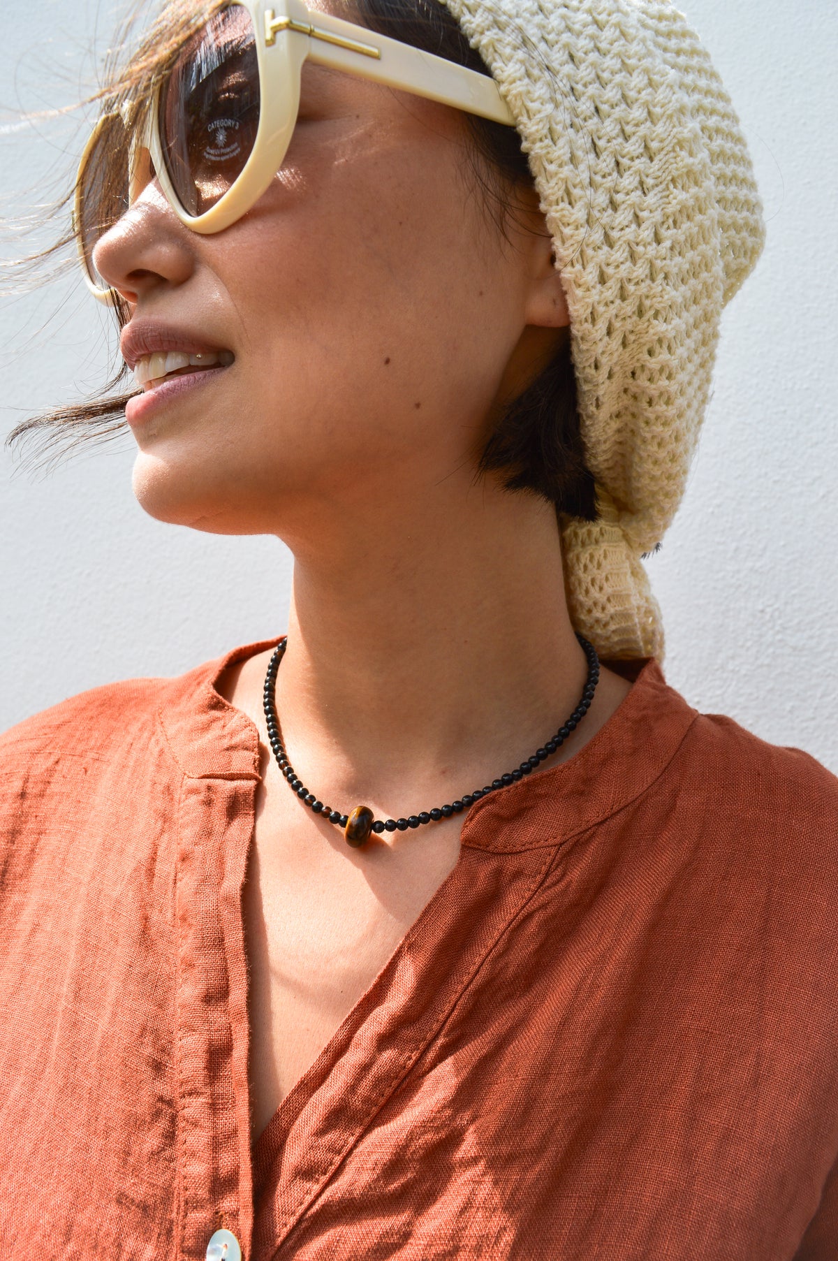 Palm Of Feronia Noir Gemstone Movement Necklace