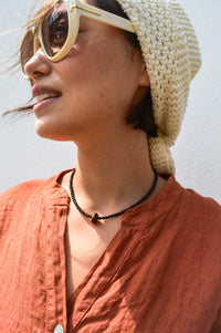 Palm Of Feronia Noir Gemstone Movement Necklace