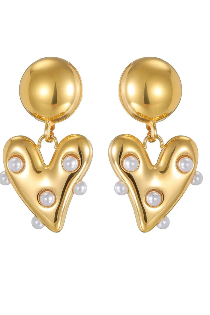 A pair of gold heart-shaped drop earrings with pearl accents, shown on a plain white background.