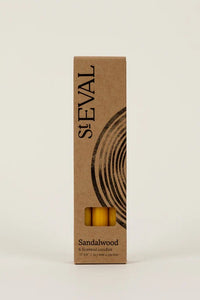 St Eval sandalwood product packaging on a beige background