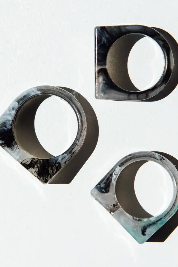 Three marble-textured rings on a white background