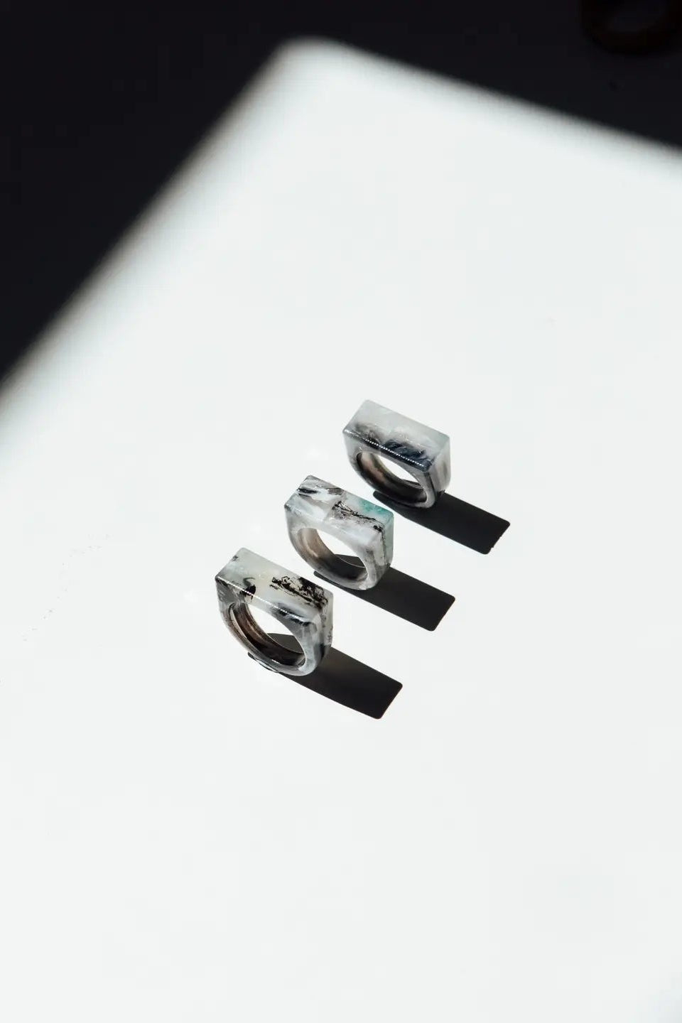 Three  rings stacked on a reflective surface