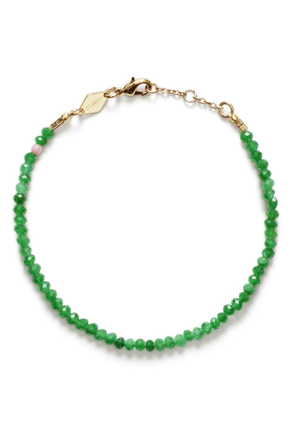 Green beaded bracelet with gold clasp on a white background