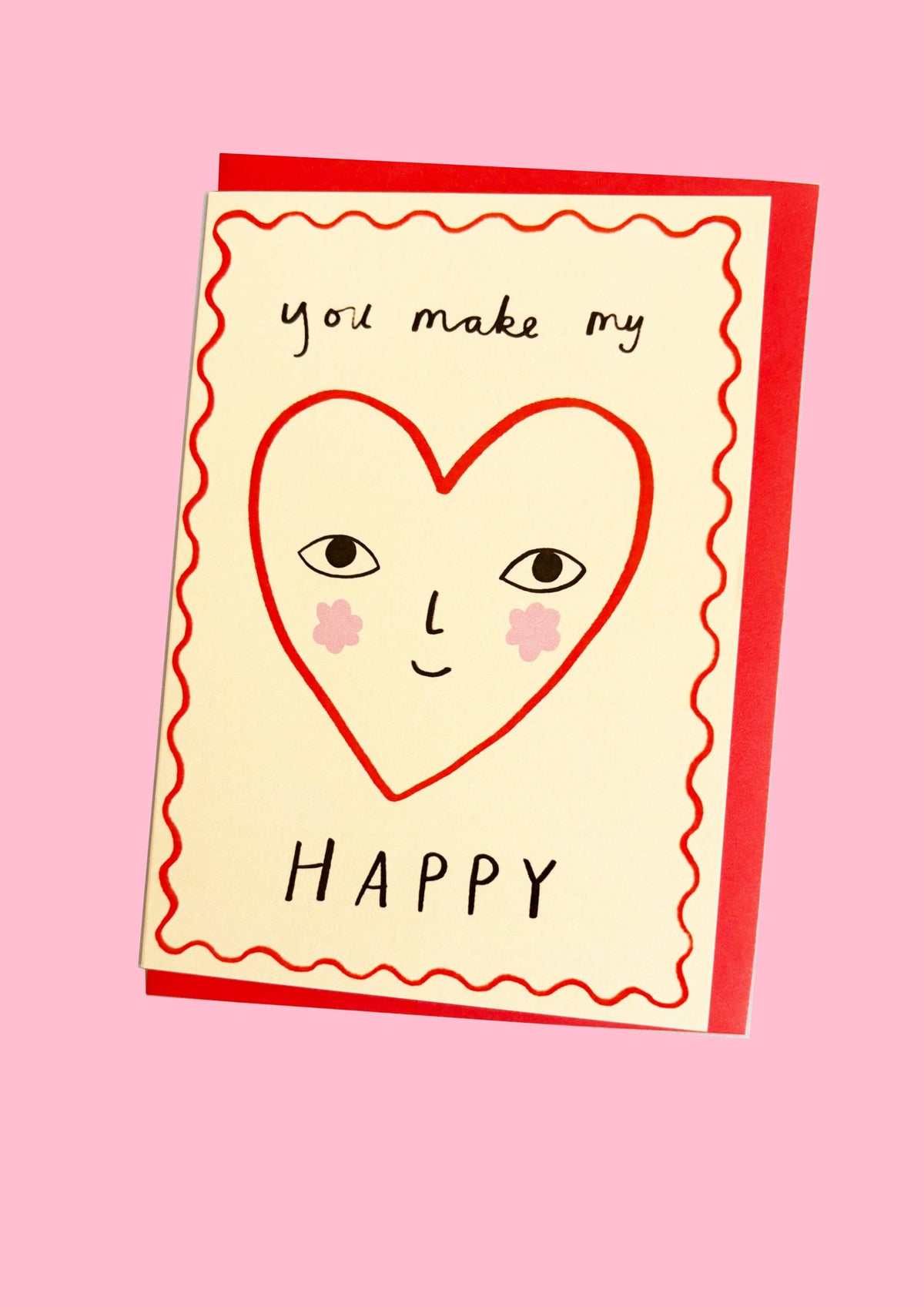 Card with a heart-shaped face and 'you make my happy' text on a pink background