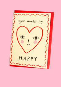 Card with a heart-shaped face and 'you make my happy' text on a pink background