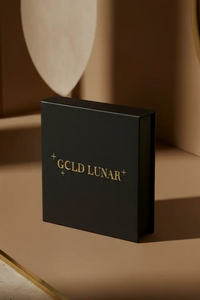 Black box with 'GOLD LUNAR' branding on a beige surface