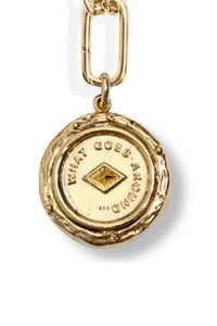 Gold pendant with chain on a white background