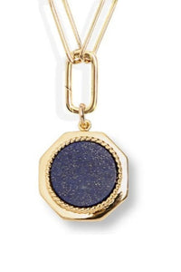 Gold necklace with a blue pendant on a white background