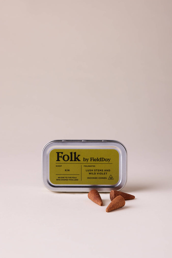Folk by Field Day product packaging with three small brown stones on a beige background