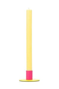 Yellow and pink cylindrical object on a white background