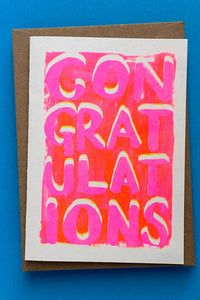 Greeting card with 'Congratulations' text on a blue background
