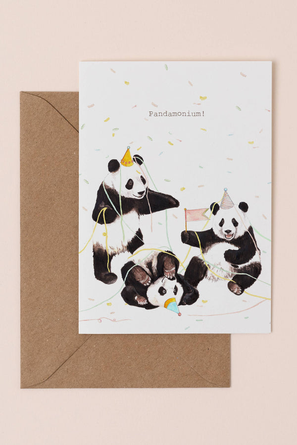 Greeting card with pandas and a brown envelope on a beige background