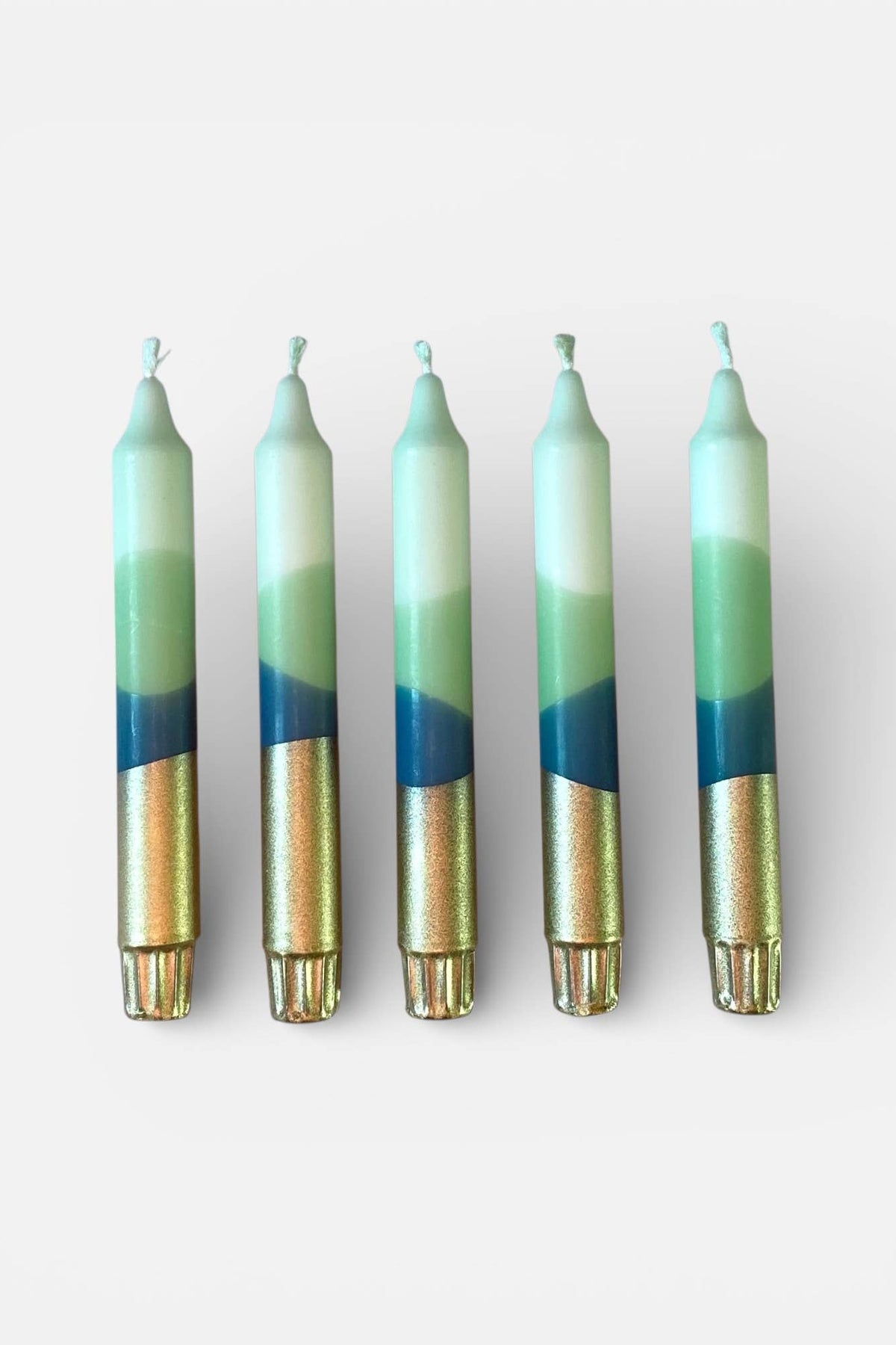 Five candles with gradient design on a white background