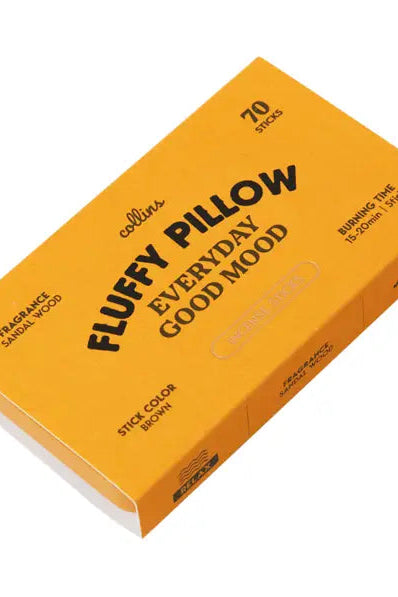 Collins Fluffy Pillow Everyday Good Mood fragrance stick box in a bright orange-yellow color with black text, shown at an angle on a white background.