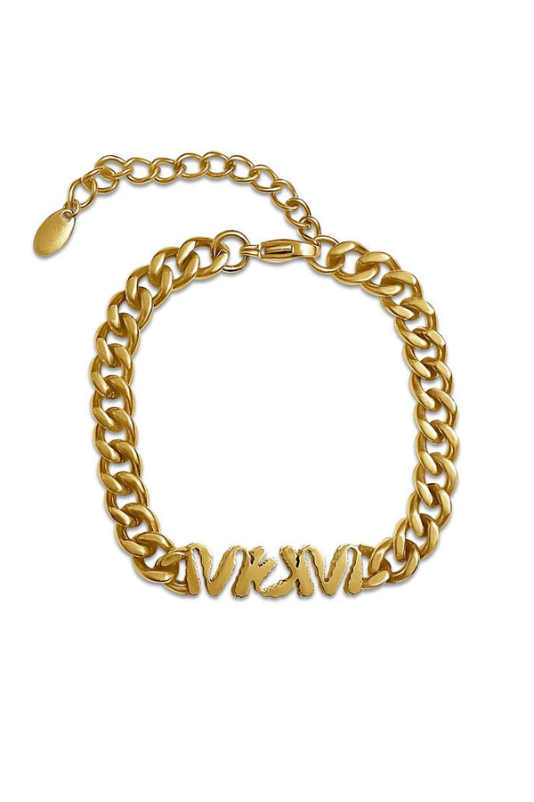 Gold chain bracelet on a white background