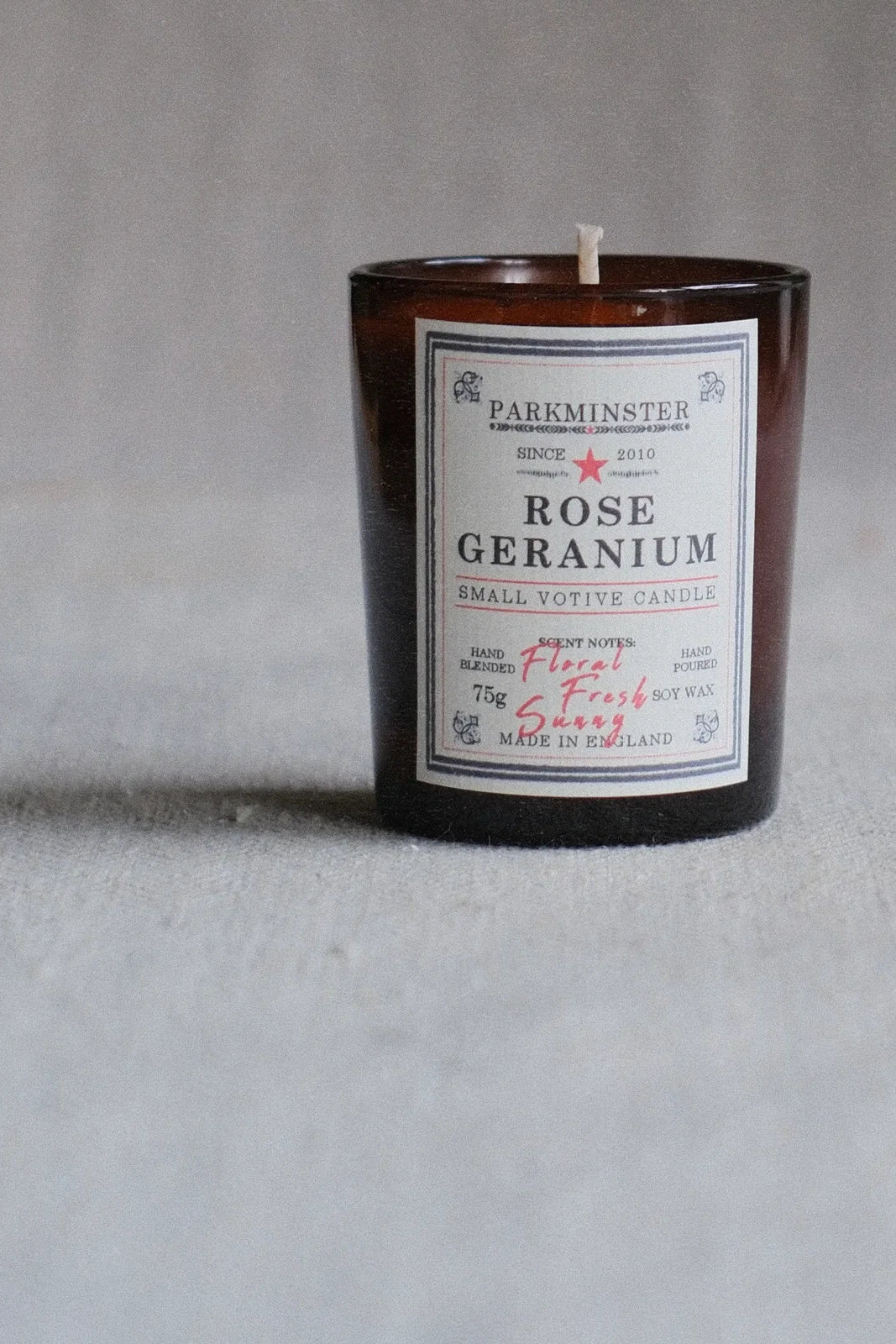 Candle with a label on a gray background