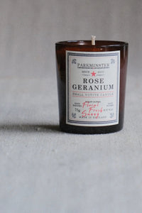Candle with a label on a gray background