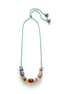 Necklace with colorful beads on a white background