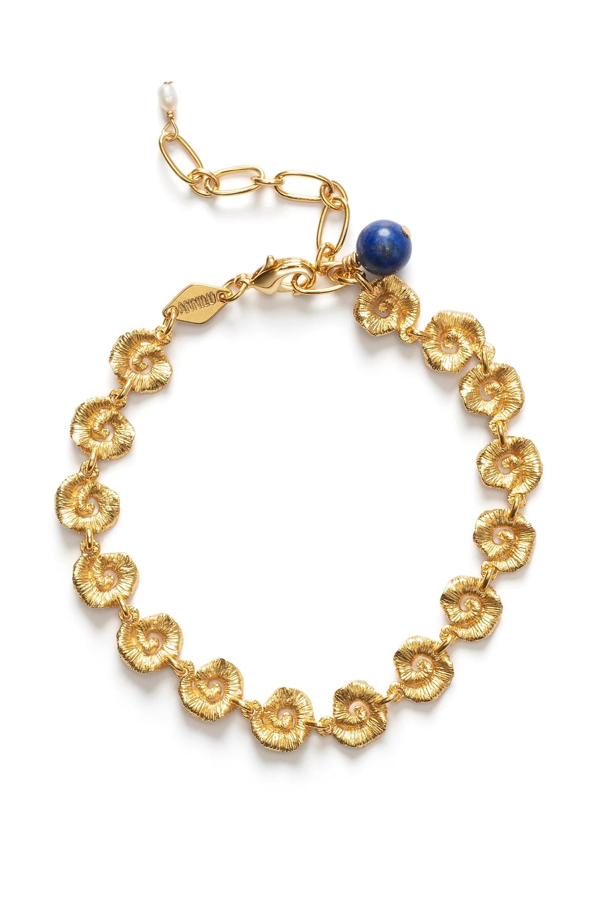 Gold bracelet with shell designs and a blue gemstone on a white background