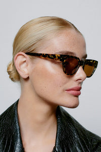 A Kjaerbede Kaws Black/Yellow Tortoise Sunglasses - The Mercantile London